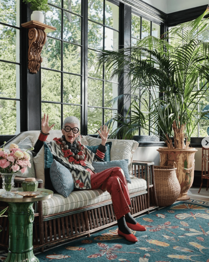 Iris Apfel: Where Age Meets Confidence in a Timeless Dance of Style.